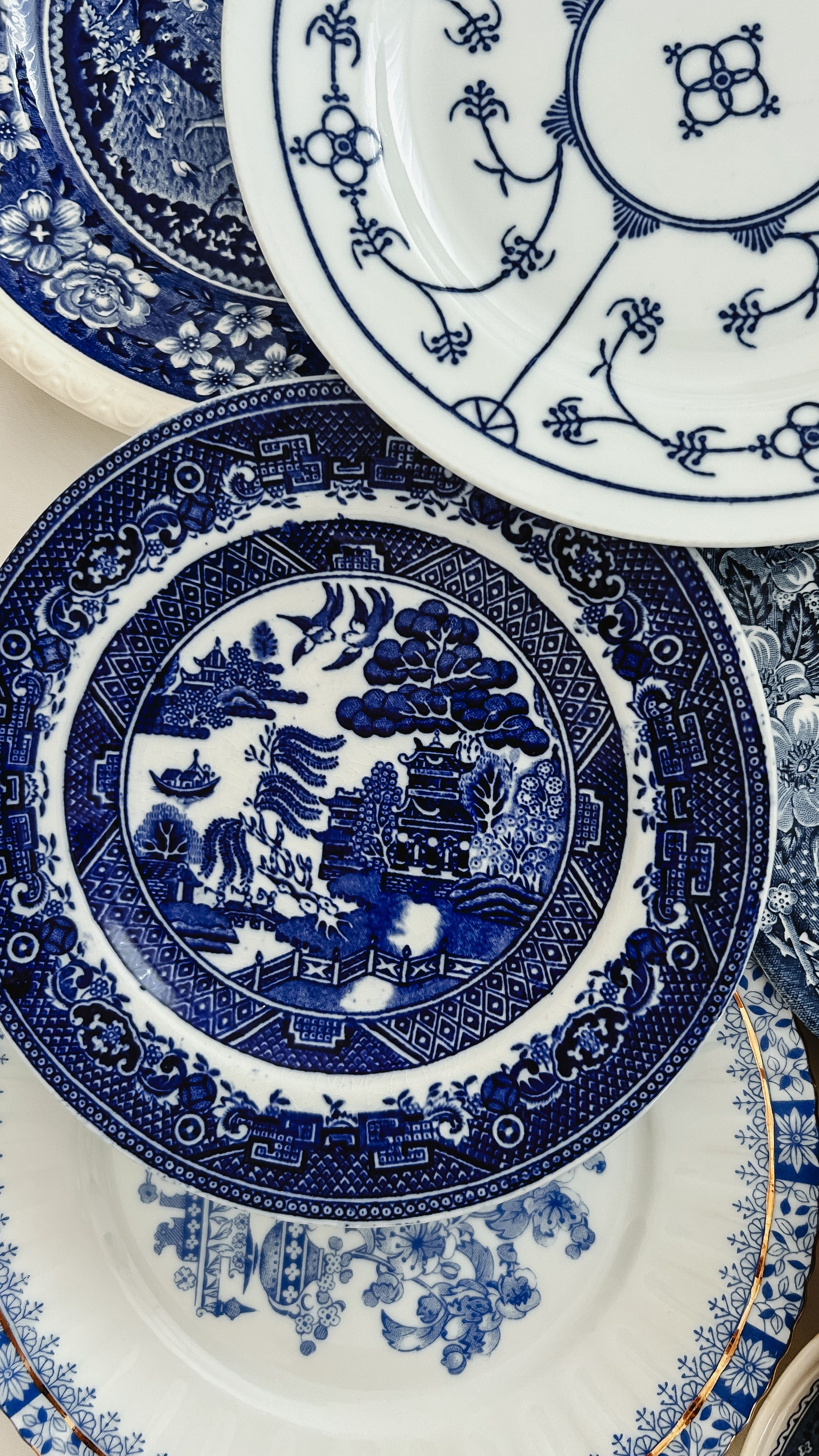 Stacked blue and white chinoiserie porcelain plates